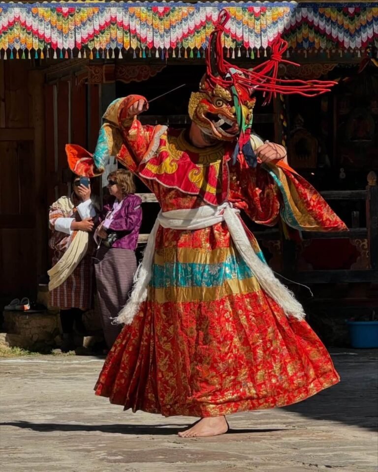Masked dancer performing at a Bhutanese festival
