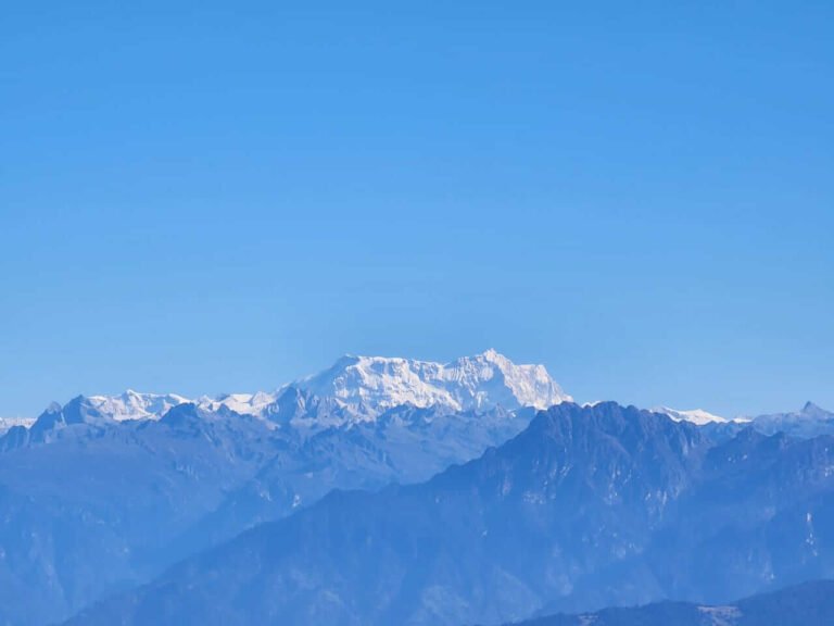 Snow-capped Himalayan range under a blue sky, Bhutan